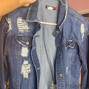 Distressed Jean Jacket. Size Medium. No visible stains or marks. Gently worn.